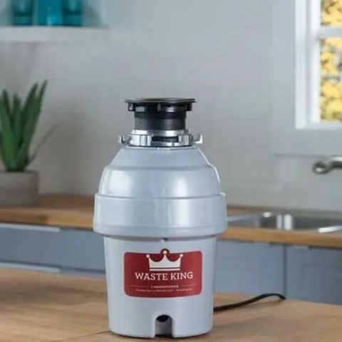 What is a continuous feed garbage disposal?