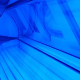 what do you clean a tanning bed with